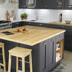 Large kitchen island with light-toned custom solid surface Edmonton, demonstrating the versatile design possibilities for local renovations.